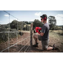 Milwaukee M18 FFUS-0C 18V Fuel Cordless Fencing Stapler (Body Only) -Dunelm Sales Store Fencing Stapler Action Shot 3 18769.1668701184